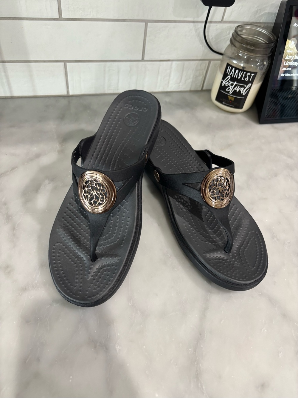 CROCS Women's Black Sandal with Rose Gold Medallion